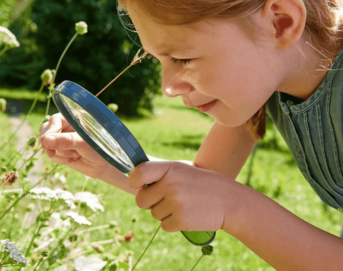 Child using HABA Terra Kids Magnifier. Available at www.tenlittle.com