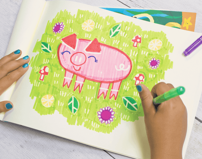 Child drawing with Ooly Make No Mistake Erasable Markers. Available at www.tenlittle.com