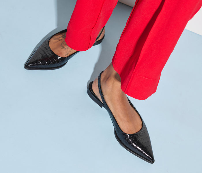 Black Marie slingback point flats by Freda Salvador, featuring sleek pointed toes and a comfortable flat sole.