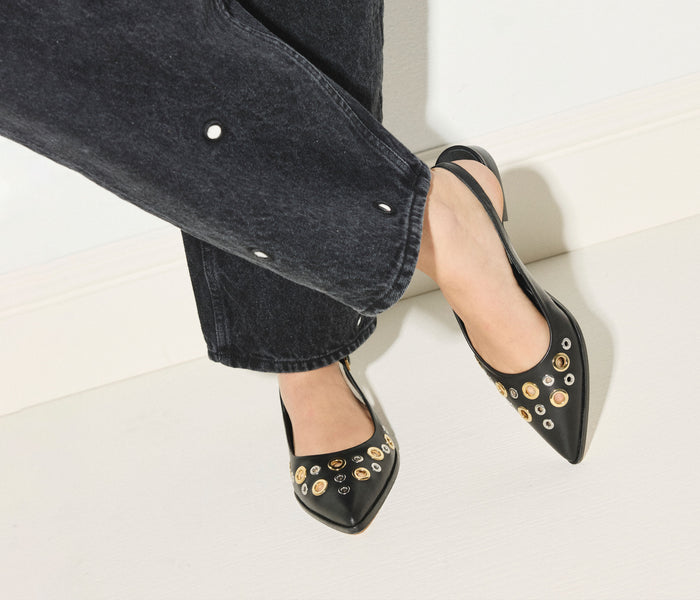 Black FREDA SALVADOR Marie Slingback Point Flat with grommet details, showcasing a stylish flat shoe with pointed toe design.