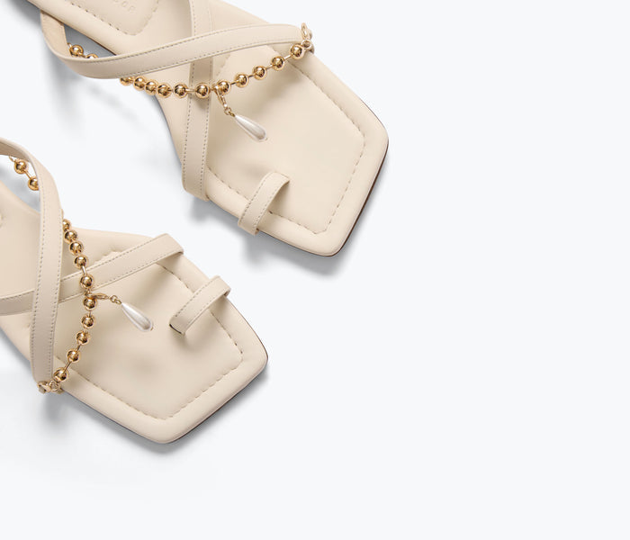 Freda Salvador Marilyn sandal with gold chain detail, featuring a stylish open-toe design and macadamia-colored straps.