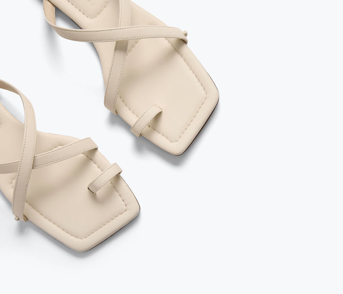 Close-up of FREDA SALVADOR Marilyn Sandal in macadamia color, showcasing the detailed strap design.