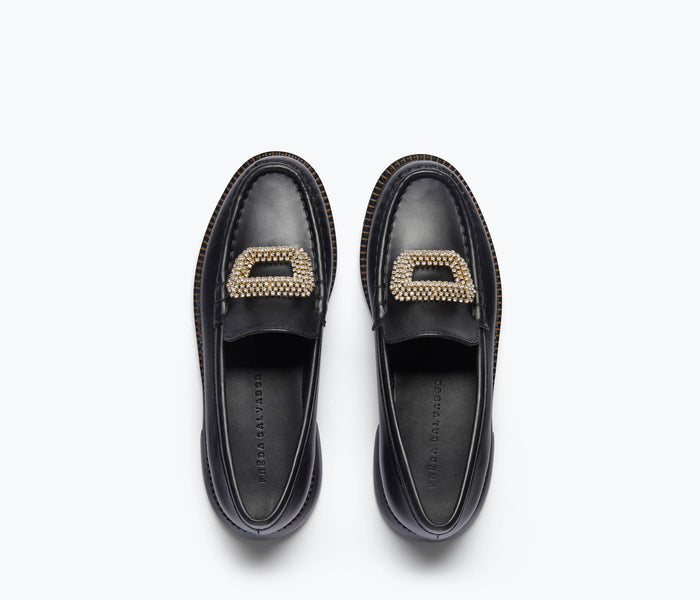 Freda Salvador Mateo crystal penny loafer in black leather with sparkling crystal accents on the top.