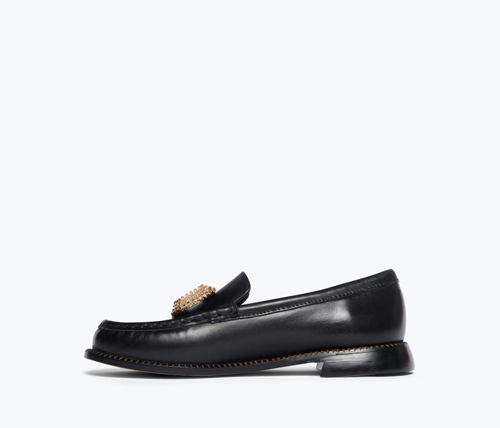 Black Mateo crystal penny loafer by Freda Salvador with crystal embellishments inside for a stylish, comfortable footwear look.