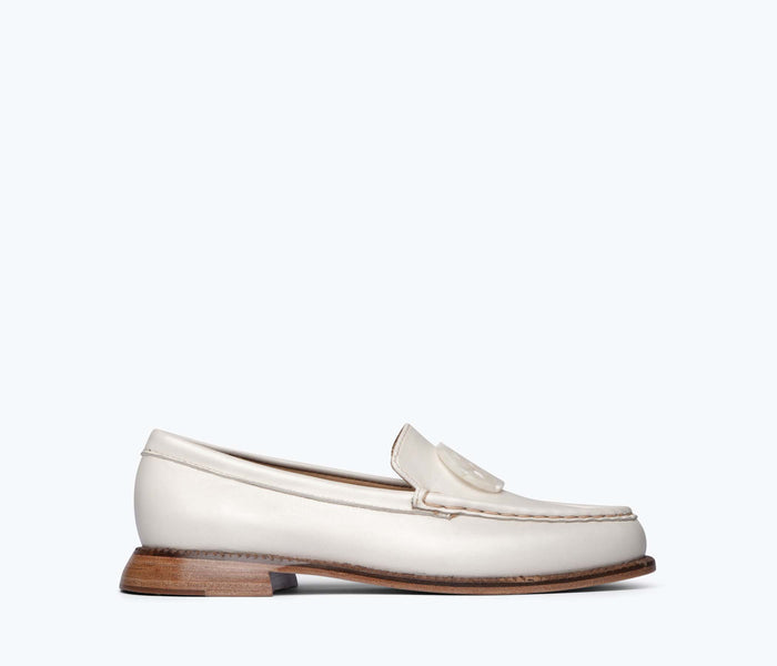 Freda Salvador Mateo resin penny loafer in bone calf leather, front view showing sleek design and classic loafer silhouette.