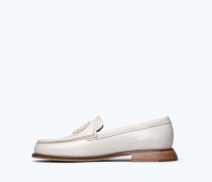 Freda Salvador Mateo resin penny loafer in bone calf leather, showing the inside view of the stylish slip-on shoe.