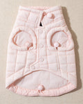 perfect on its own or layered with a cute sweater. This quilted, stylish jacket is fully adjustable, with coordinating light pink cords on the hem, neck, and arm openings. Jacket can be worn over harness, with a small opening for leash attachment on the back. Asymmetrical buttons also make for more secure wear, for even the most portly of pups!. Chihuahua pink jacket.