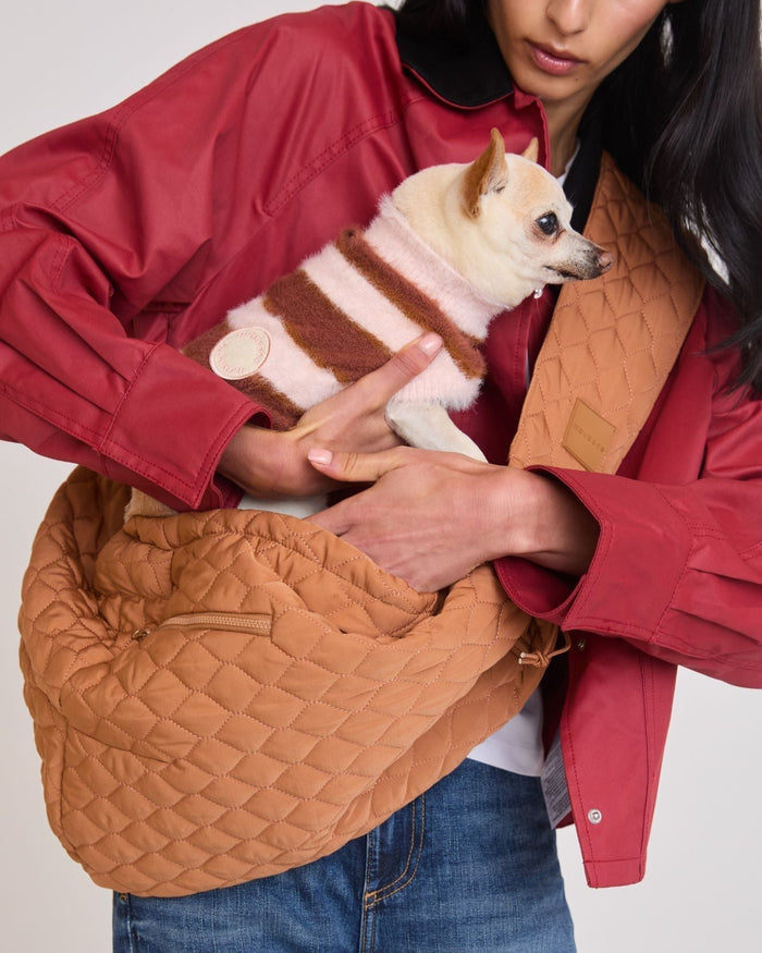 Eco-friendly camel pet sling made with recycled nylon and water bottles, designed for small dogs up to 10 pounds