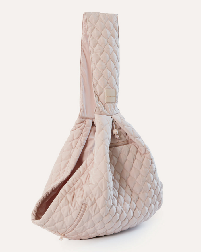 Recycled nylon nude dog carrier sling that packs into a convenient pouch for small dogs up to 10 pounds