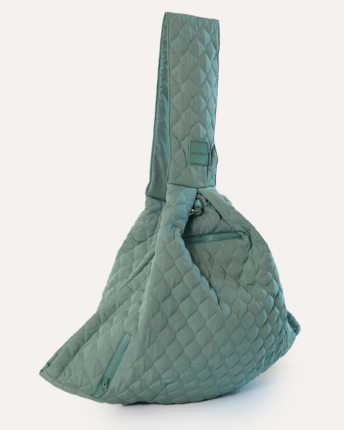 Eco-friendly sage pet sling made with recycled nylon and water bottles, designed for small dogs up to 10 pounds