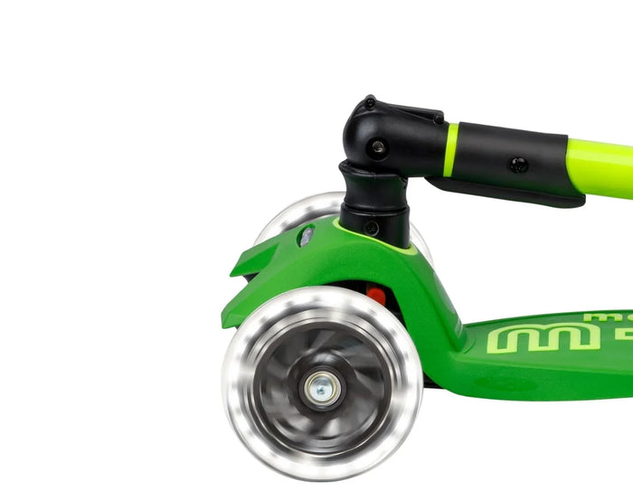 Close up of light-up wheel on Micro Kickboard Maxi Deluxe Foldable LED Scooter - Neon Parrot Green. Available at www.tenlittle.com