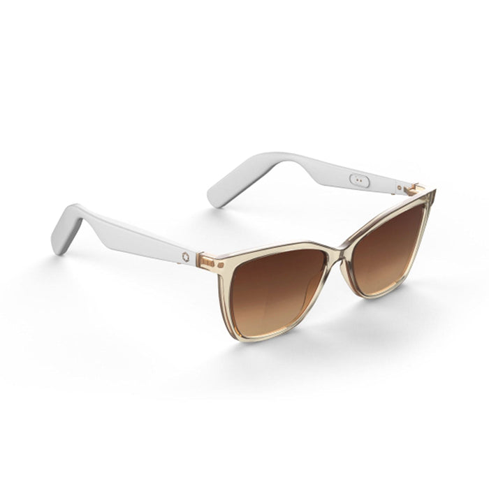 The Lucyd Millennia women's eyewear features clear, slightly amber-tinted frames, white arms, and brown gradient lenses, displayed against a white background.