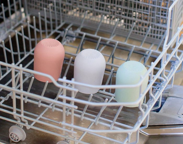 Ezpz Mini Cup & Straw in different colors at the dishwasher - Available at www.tenlittle.com