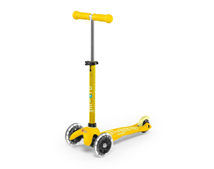 Front and side view of Micro Kickboard Mini Deluxe LED Scooter - Yellow. Available at www.tenlittle.com