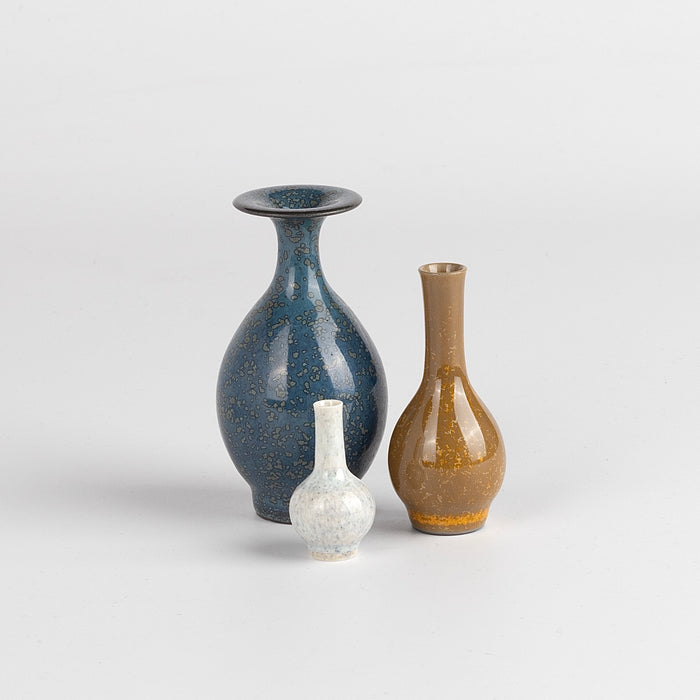 Miniature Hand Thrown Ceramic Vase Trio in Spotted Blue, Brown and Moonstone White are three tiny and hand thrown ceramic vases hand thrown by Japanese born, UK based potter Yuta Segawa