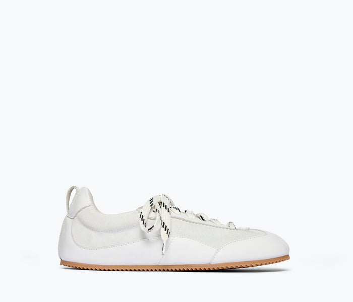 Fredas Salvador Minnie ballet sneaker in milk calf leather, front view showing sleek design and soft pastel color.