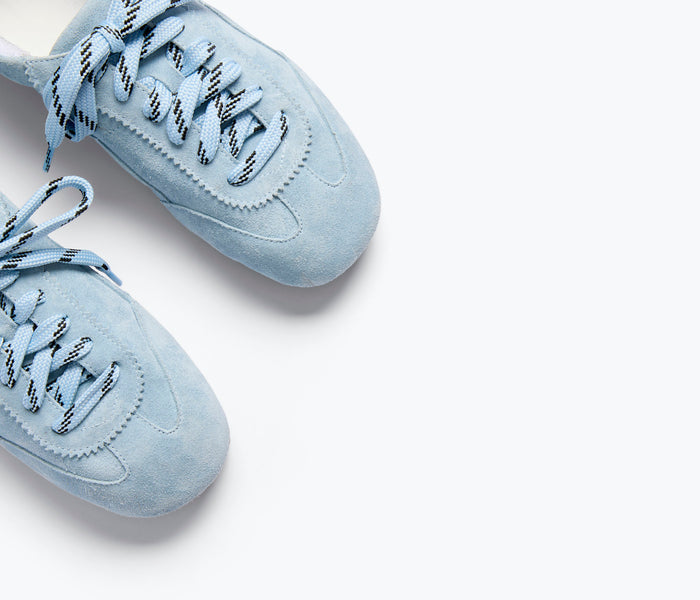 Sky blue Minnie ballet sneaker by Freda Salvador with soft fabric and delicate bow detail, perfect for casual and stylish wear.