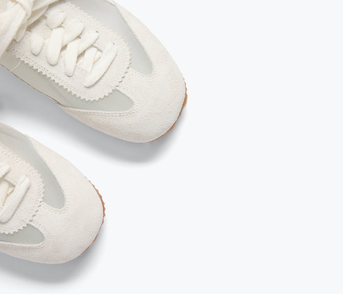 Freda Salvador Minnie ballet sneaker in ivory suede with detailed stitching and sleek ballet-inspired design.