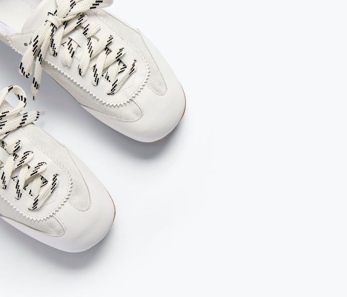 Fredas Salvador Minnie ballet sneaker in milk calf leather with detailed side view showing sleek design and soft material.