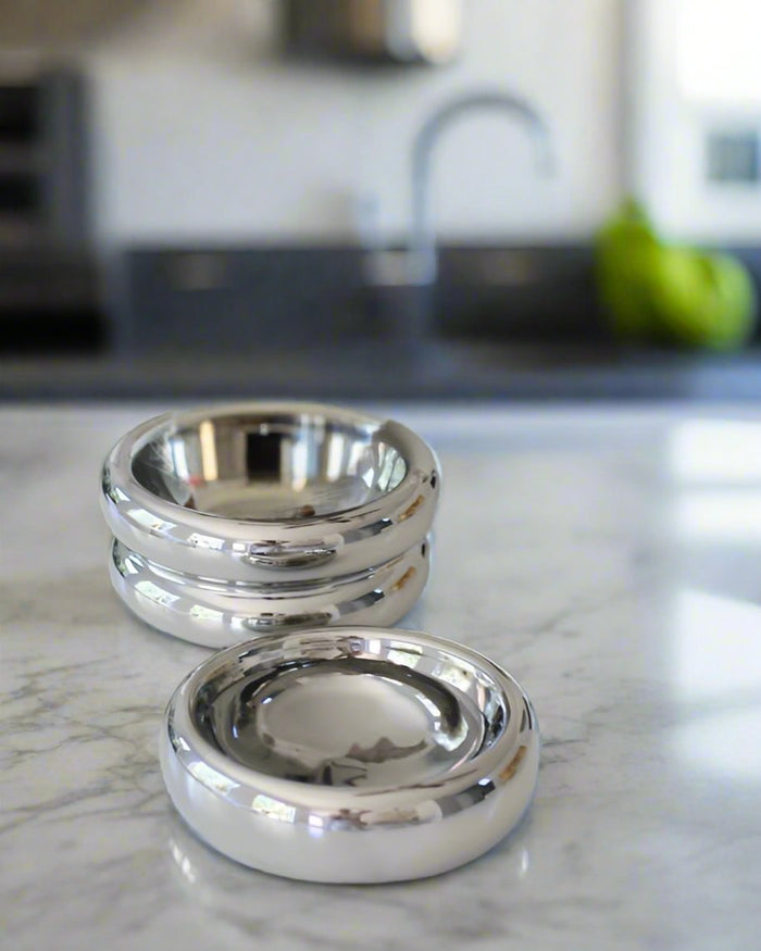 Modern Muse tall pet bowl in shiny chrome, perfect for stylish breeds like Bichons or French Bulldogs.