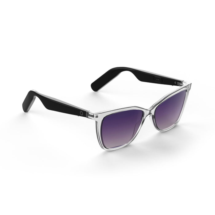 The Lucyd Moonrise is a pair of modern women’s sunglasses featuring champagne crystal frames, black arms, and polarized purple gradient lenses, shown resting on a white surface.