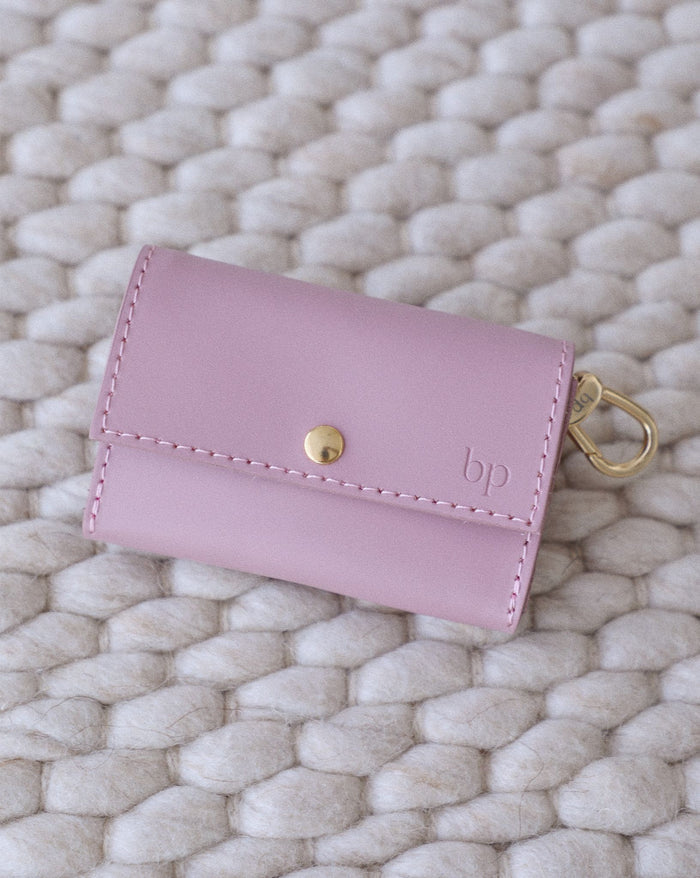 Lifestyle image of small dog wearing mauve studded leather collar with matching leash for safe and stylish walks