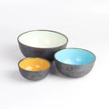 Set of bowls by One Kiln on white background.
