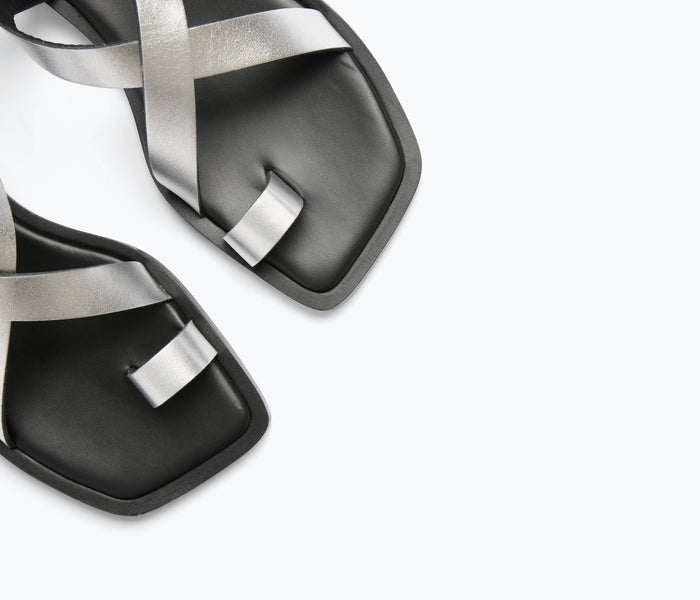 FREDA SALVADOR Paxton sandal in silver, calf leather with detailed strap design, open toe and flat sole.
