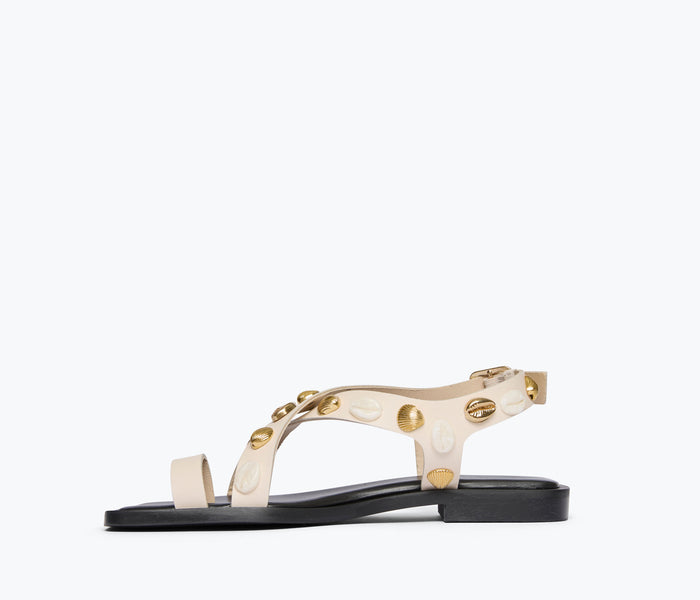 Freda Salvador Paxton sandal in bone color with gold shells and calf leather, open-toe design, showcasing stylish, handcrafted footwear.