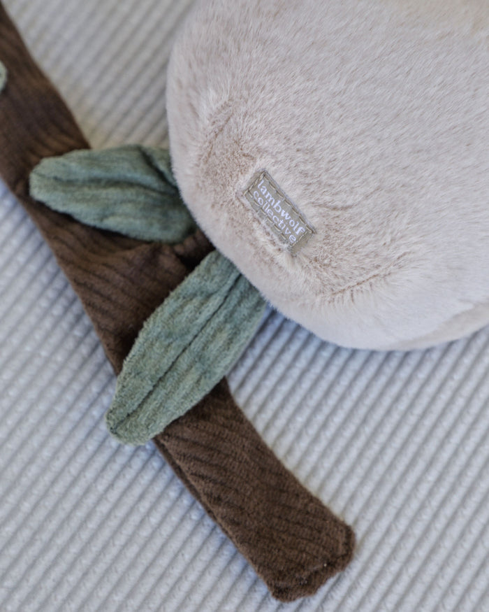 Peachy Keen Plush Dog Toy with two peaches, perfect for interactive play and tasty treats.