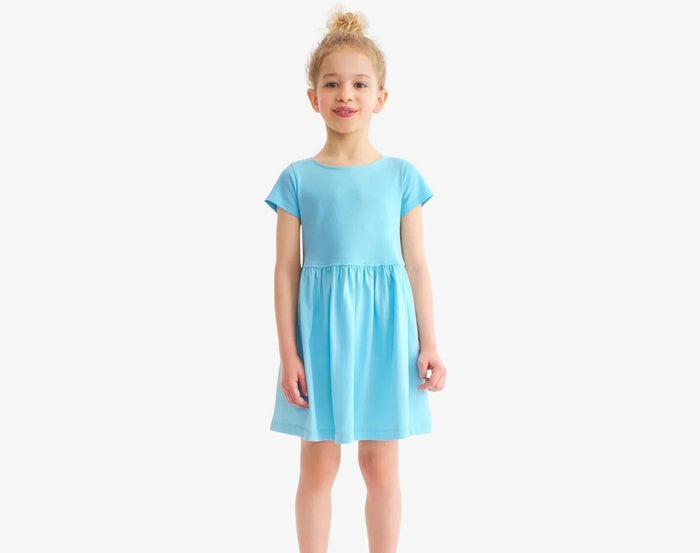 Child wearing Primary Pocket Dress - Lagoon. Available at www.tenlittle.com