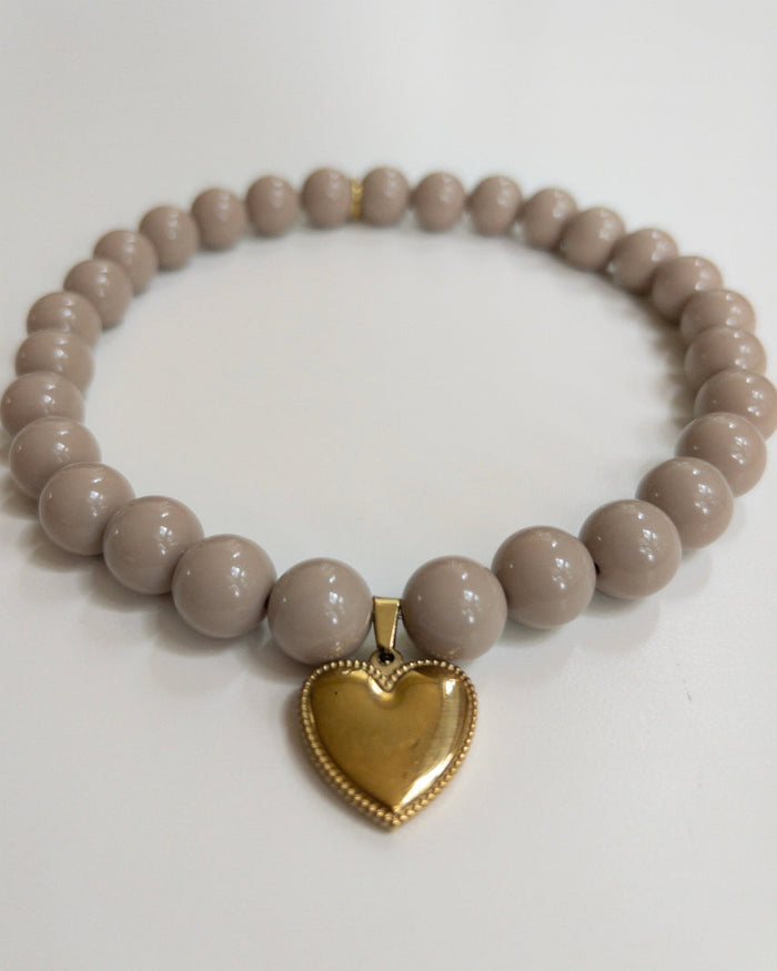 Close-up of Polished Pup taupe beaded dog necklace, stylish small dog accessory with elegant neutral beads for daily wear and photoshoots