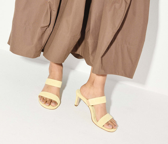 Fredas Salvador Poppy double strap heel in vibrant citrus suede, featuring stylish open-toe design and elegant block heel.