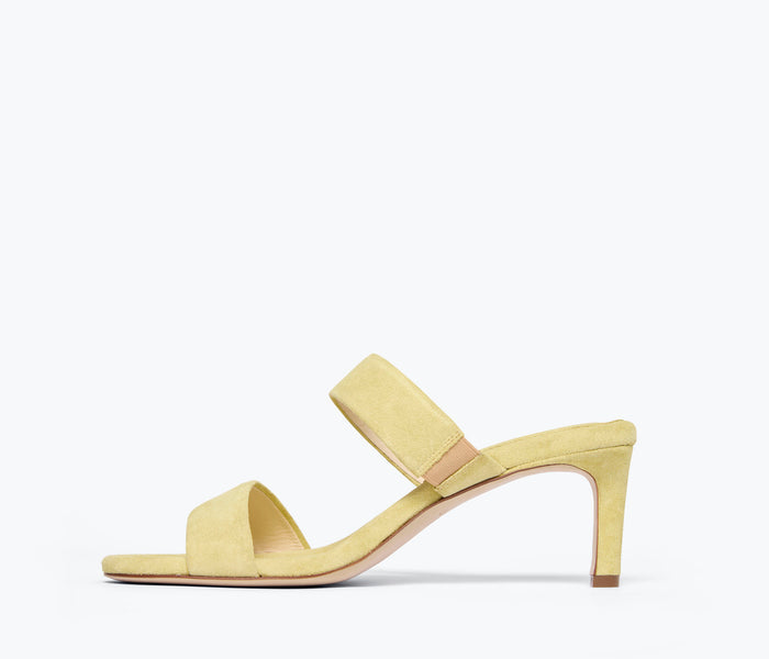 Freda Salvador Poppy double strap heel in citrus suede shown from inside angle, highlighting stylish design and vibrant color.