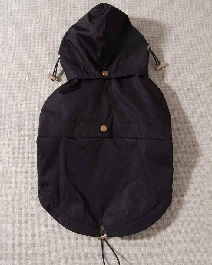 black dog raincoat with leopard print lining and removable hood. poodle rain coat