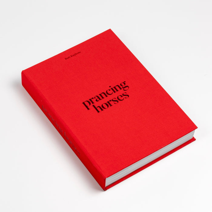 Prancing Horses photo book by Bart Kuykens is the story of Ferrari classic cars and drivers shot in black and white and color utilizing analog photography.