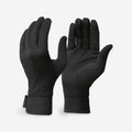 Pair of black gloves on a light gray background