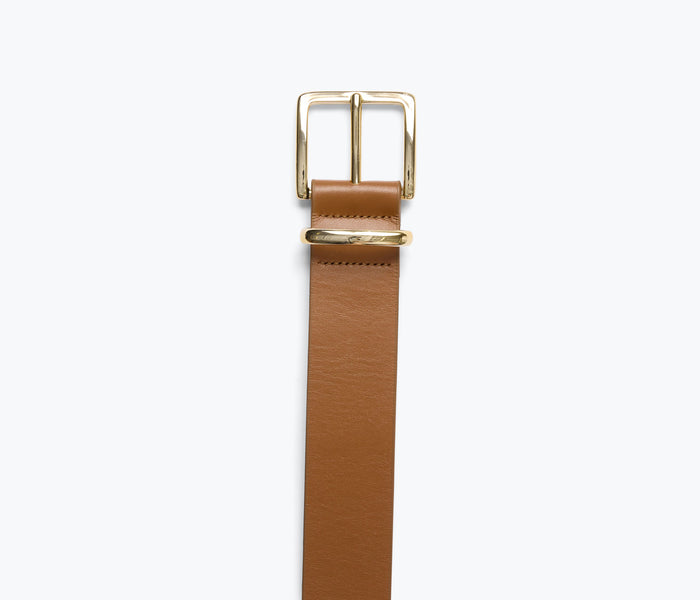 Freda Salvador Randy belt in walnut leather with gold hardware, showcasing detailed close-up of strap and buckle design.