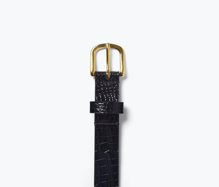 FREDA SALVADOR Rebecca Belt featuring a sleek black leather strap with metal buckle detail.
