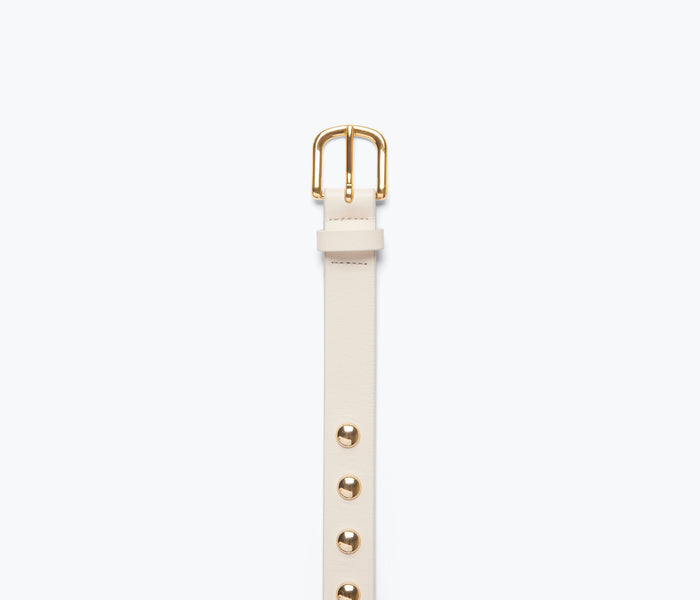 Freda Salvador Rebecca belt in bone color with gold stud accents, featuring a sleek leather strap and stylish buckle detail.