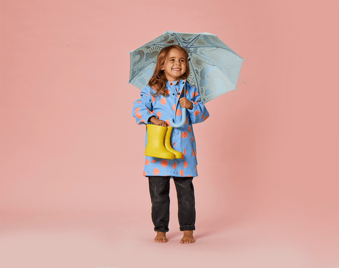 Child wearing Snapper Rock Recycled Waterproof Raincoat - Polka Dot. Available at www.tenlittle.com
