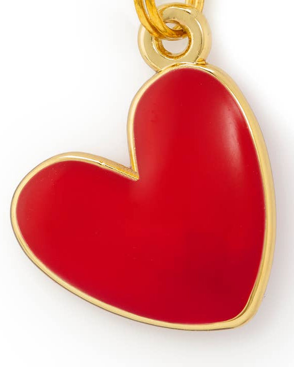 Decorative red heart charm accessory for dog collars adding color and personality, perfect for trendy pet fashion looks