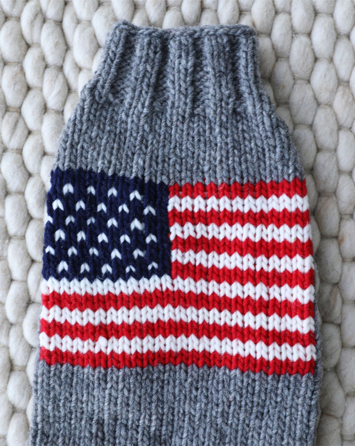 Patriotic red, white, and blue dog sweater ideal for small-medium breeds like Pugs, Mini Schnauzers, and Cocker Spaniels.