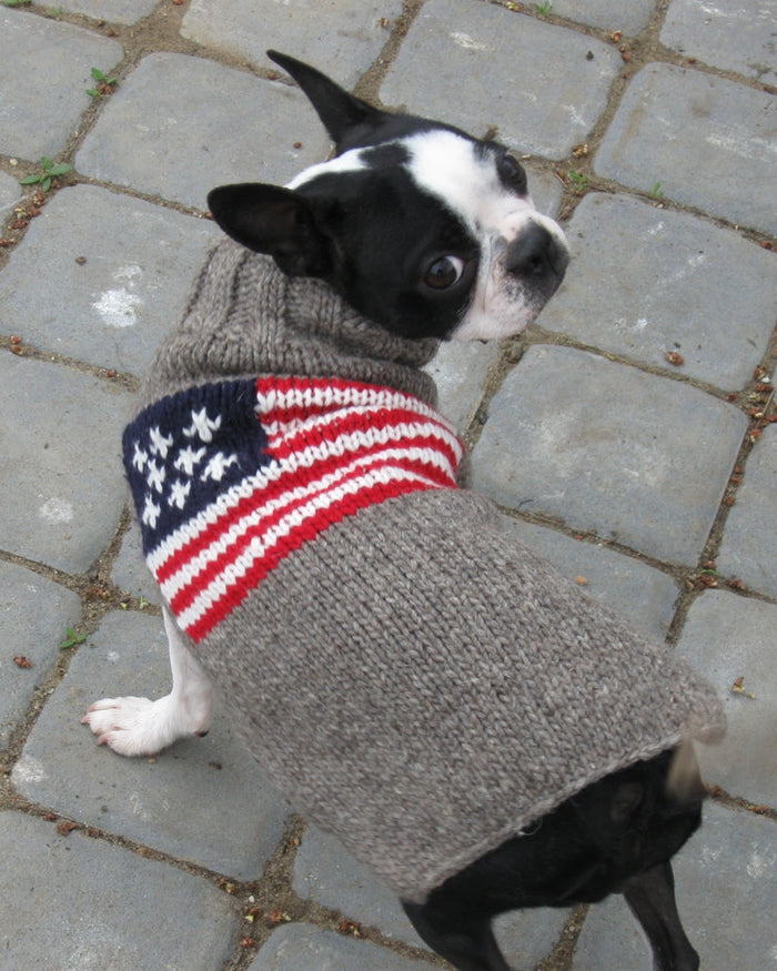 Small to medium dogs look festive in Red, White + Woof Sweater. Fits Pomeranians, Boston Terriers, and French Bulldogs comfortably.