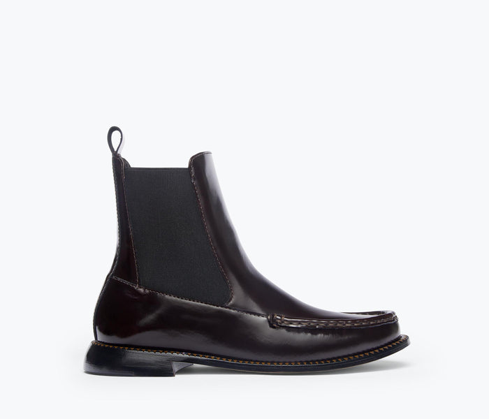 Freda Salvador Renn Moccasin Chelsea Boot in espresso leather, front view showing sleek design and elastic side panels.