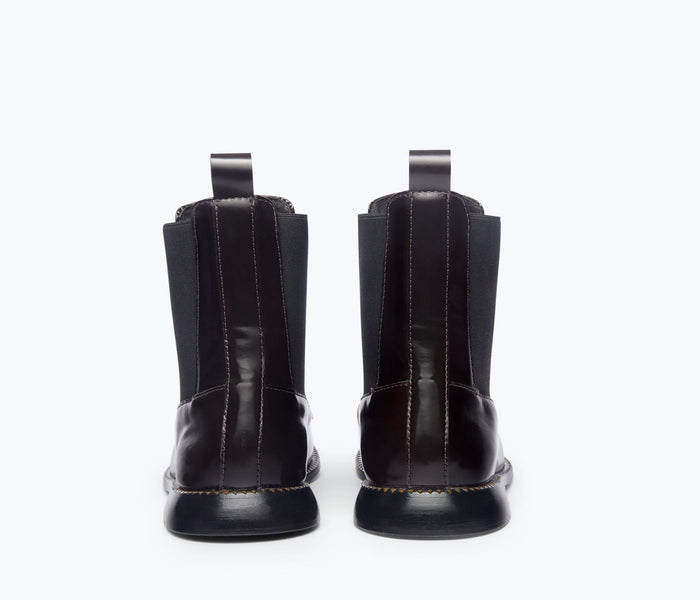 Freda Salvador Renn Moccasin Chelsea boot in espresso leather, back view showing sleek design and sturdy heel.