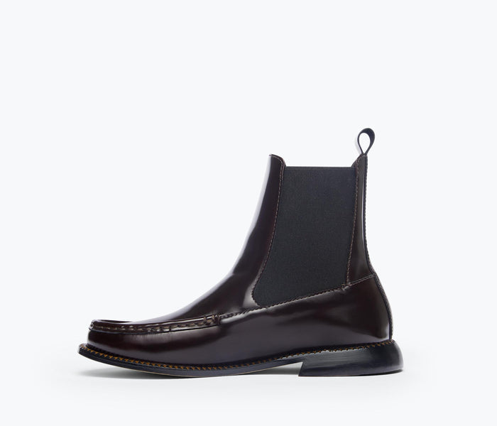 Freda Salvador RENN moccasin Chelsea boot in espresso leather, showing the inside view with detailed stitching and soft interior.