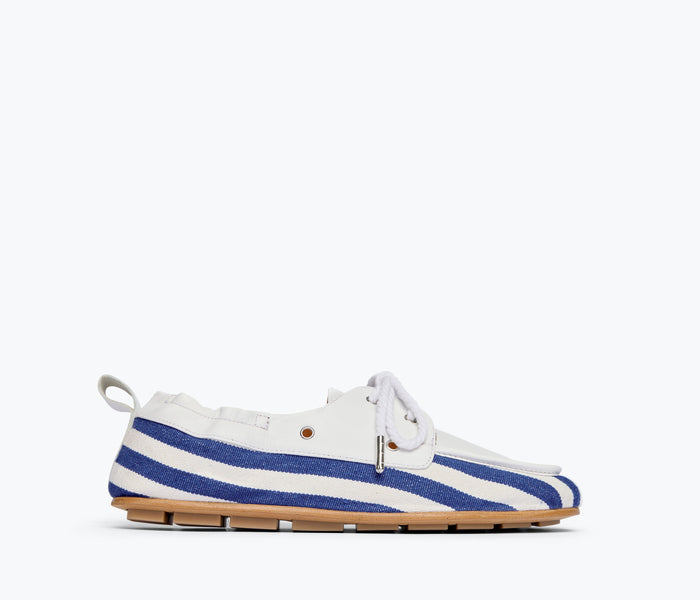 Navy and white canvas RIA soft boat loafer by Freda Salvador, front view showing sleek design and boat shoe style.