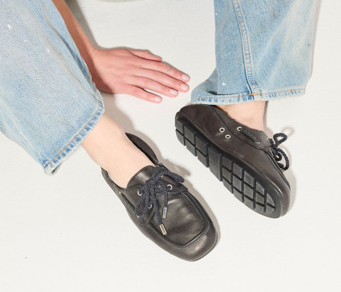 Black RIA soft boat shoe loafer by Freda Salvador, featuring sleek nappa leather with a classic boat shoe design.