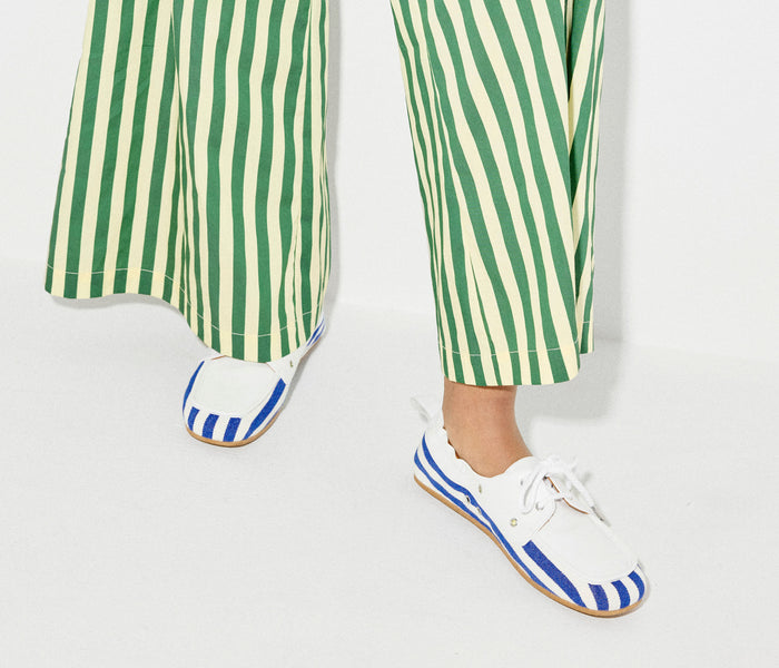 Freda Salvador RIA soft boat shoe loafer in navy and white canvas, showing a stylish slip-on design with a smooth, comfortable fit.